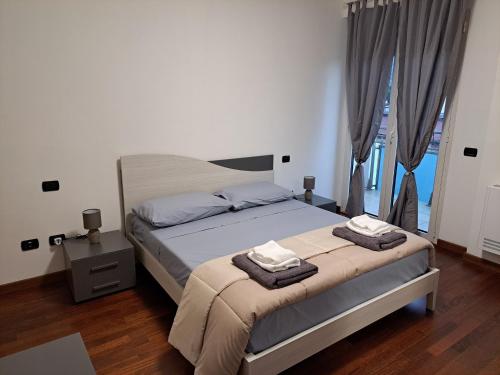 Ένα ή περισσότερα κρεβάτια σε δωμάτιο στο Savoia Home