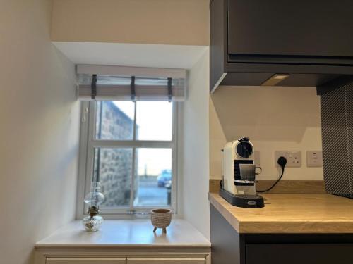 Küche/Küchenzeile in der Unterkunft Coorie-In Cottage