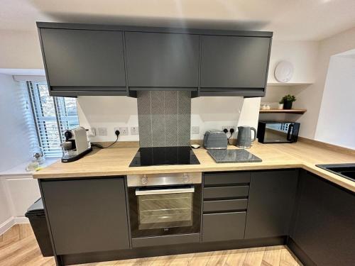 Küche/Küchenzeile in der Unterkunft Coorie-In Cottage