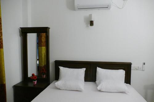 Ένα ή περισσότερα κρεβάτια σε δωμάτιο στο ARIYASIRI k VILLA