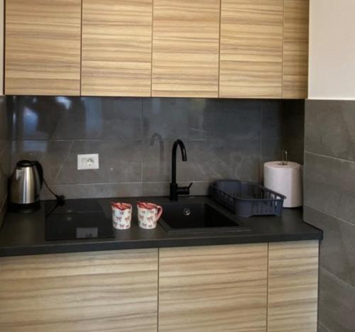 Küche/Küchenzeile in der Unterkunft M&A apartman