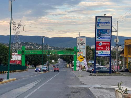 a street with many signs on the side of a road at Casa-Patio Bugambilias in Temixco
