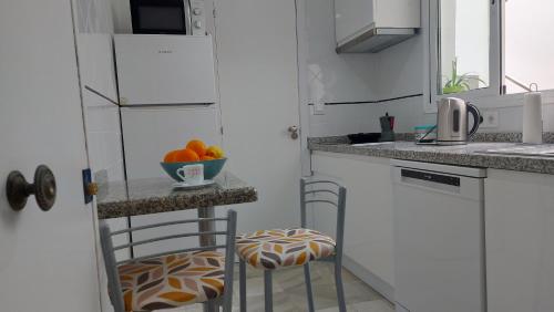 Kuchyň nebo kuchyňský kout v ubytování Típica casa sevillana en el barrio de Triana
