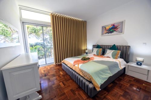 Postel nebo postele na pokoji v ubytování Sea Breeze II