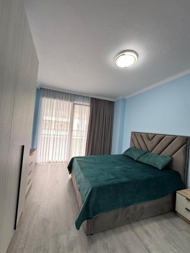 Ένα ή περισσότερα κρεβάτια σε δωμάτιο στο Blu Apartamen Nearly Airoport Tirana