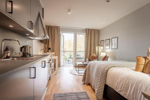 Ένα ή περισσότερα κρεβάτια σε δωμάτιο στο Uppsala Hotel Apartments