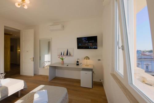 TV a/nebo společenská místnost v ubytování Camera Rio - La Casa di Carta Affittacamere