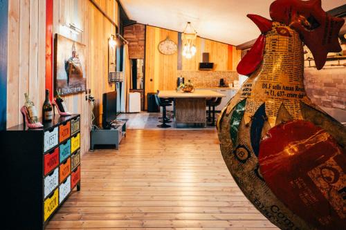 a kitchen with a large vase in the middle of a room at La Grange in Sablons