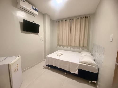 Postel nebo postele na pokoji v ubytování Sky Hotel Ltda