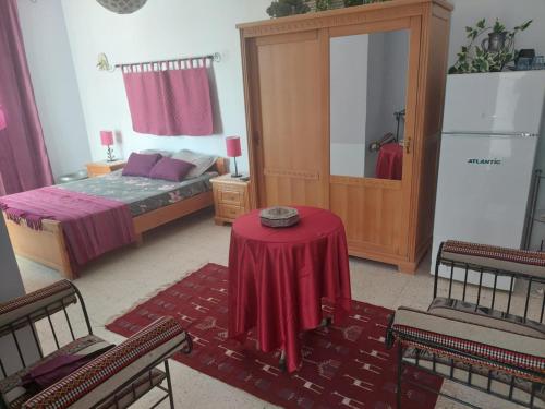 Postel nebo postele na pokoji v ubytování chambre Noix de Coco résidence Chahrazad