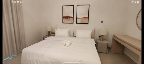 Ένα ή περισσότερα κρεβάτια σε δωμάτιο στο Formula Luxe Studio Yas Island