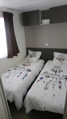 Ένα ή περισσότερα κρεβάτια σε δωμάτιο στο Mon petit nid