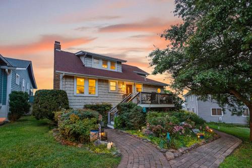 a house with a brick walkway in the yard at Magical Bayfrnt Home, Pier, Beach, Fossils, Trails in Port Republic