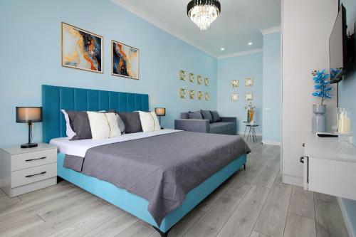 Ένα ή περισσότερα κρεβάτια σε δωμάτιο στο Современный апартамент в центре Алматы, Mega Park - Arbat