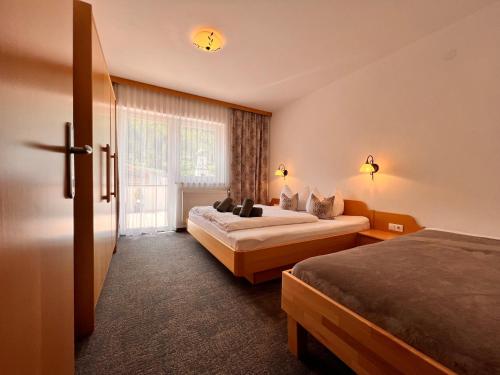 Giường trong phòng chung tại Appart Kofler