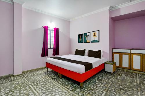 a bedroom with a large bed in a room at HOTEL O REEYH INN in Khāpri