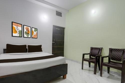 Giường trong phòng chung tại Hotel O Nandan Palace