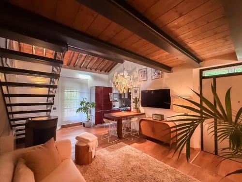 a living room with a couch and a table at Cognaia Loft in Arezzo
