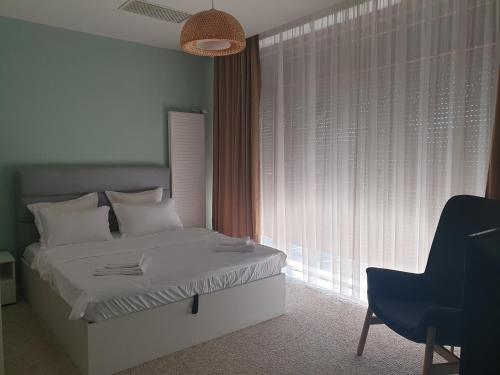 Ένα ή περισσότερα κρεβάτια σε δωμάτιο στο River Apartment