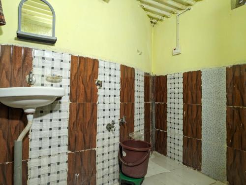 a bathroom with a sink and a toilet at White Land Villagestay in Dhordo