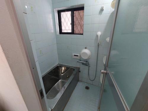 Koupelna v ubytování Direct access to Umeda Osaka! Direct access to Namba, convenient to Kansai Airport, free parking, maximum 8 people, best for families