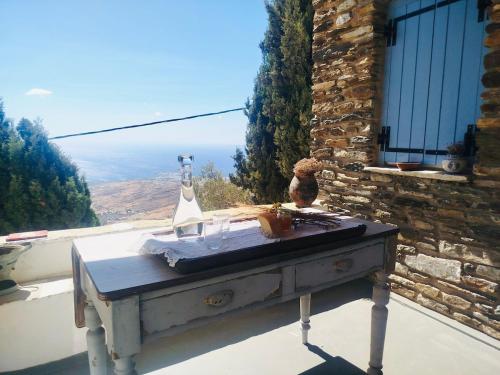 a table in front of a window with a view at Vista Tinos in Triandáros