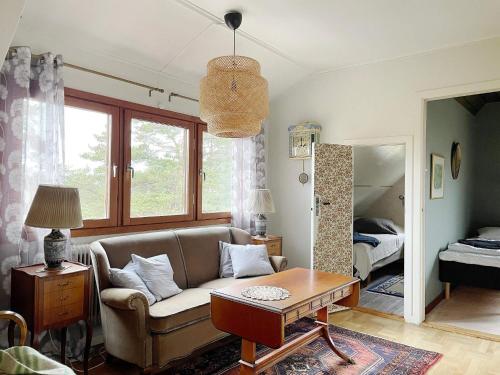 een woonkamer met een bank en een tafel bij 4 star holiday home in VISBY in Visby
