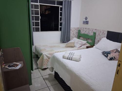 Ένα ή περισσότερα κρεβάτια σε δωμάτιο στο Hostel mi casa su casa