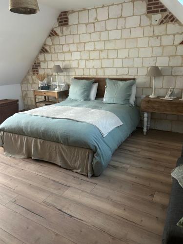 Ένα ή περισσότερα κρεβάτια σε δωμάτιο στο l'abreuvoir de rivière