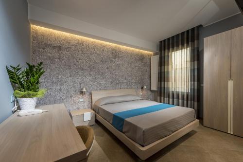 Postel nebo postele na pokoji v ubytování Hotel Vento del Sud