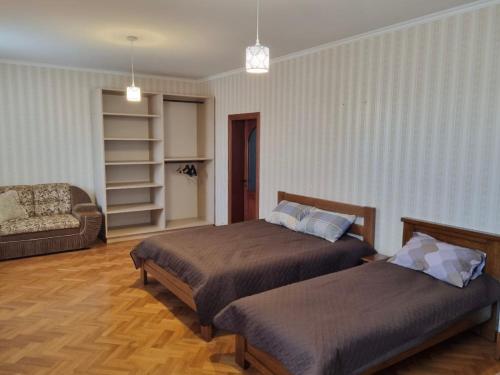 a hotel room with two beds and a couch at Felicità Family Club 