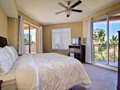 a bedroom with a bed and a large window at Belle Harbor 401W in Clearwater Beach