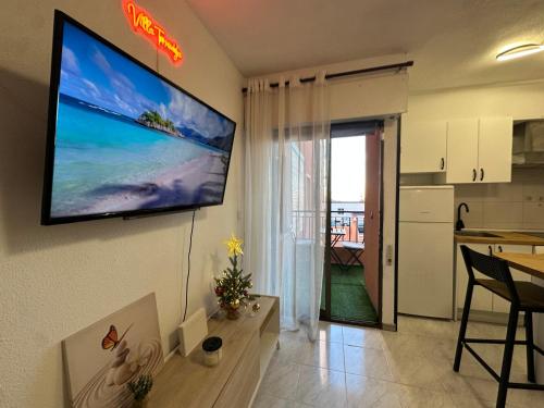 a living room with a flat screen tv on the wall at Villa Torrevieja in Torrevieja