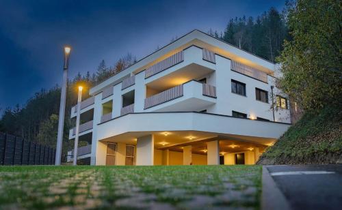 a large white building with a street light in front of it at Apartment Lisa Hinterstoder in Hinterstoder