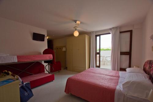 Ένα ή περισσότερα κρεβάτια σε δωμάτιο στο Hotel Desiree