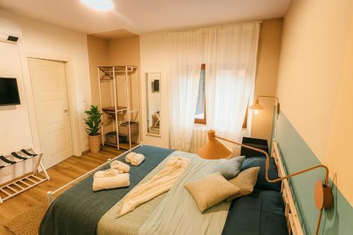 Postel nebo postele na pokoji v ubytování Casa AlmaMare