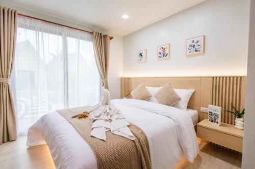 Postel nebo postele na pokoji v ubytování Triple Dreams Resort