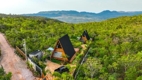 an overhead view of a house in a forest at Zamaya Bangalôs in Sao Jorge
