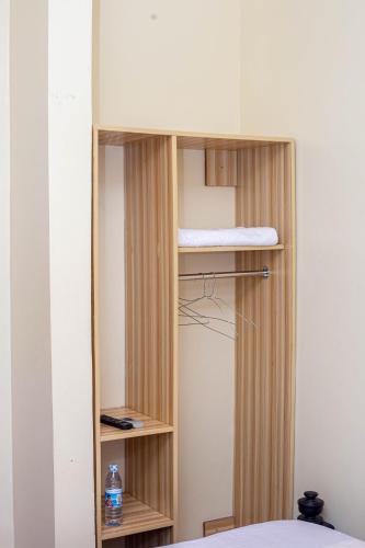 a room with a bunk bed in a room at White Ash Studios Komamboga in Kampala