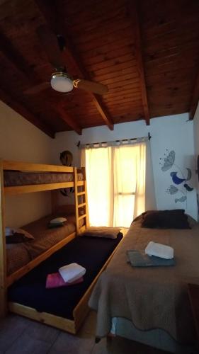 Ένα ή περισσότερα κρεβάτια σε δωμάτιο στο El Rincón de Siquiman