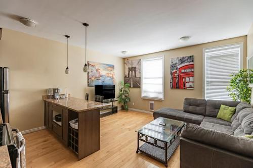 a living room with a couch and a table at Suitestay Apartments Hotel in Ottawa