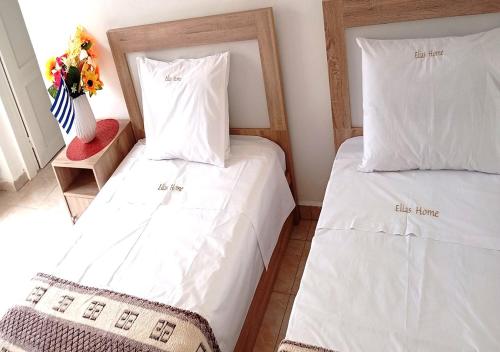 Postel nebo postele na pokoji v ubytování Elias Home