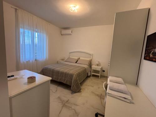 Ένα ή περισσότερα κρεβάτια σε δωμάτιο στο a&g partenope