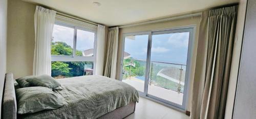 Ένα ή περισσότερα κρεβάτια σε δωμάτιο στο Brand New Luxe Condo - Amazing Ocean Views