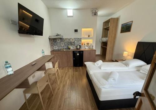 Ένα ή περισσότερα κρεβάτια σε δωμάτιο στο La Maison San LaZaro