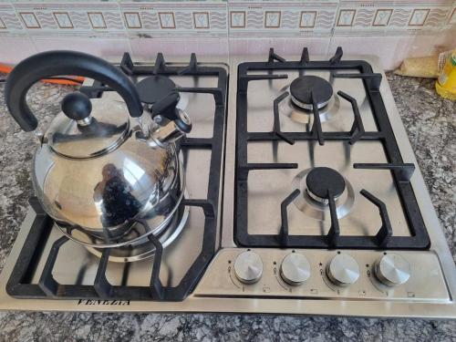 Una cocina o cocineta en Cosy studio And Tidy Apartment