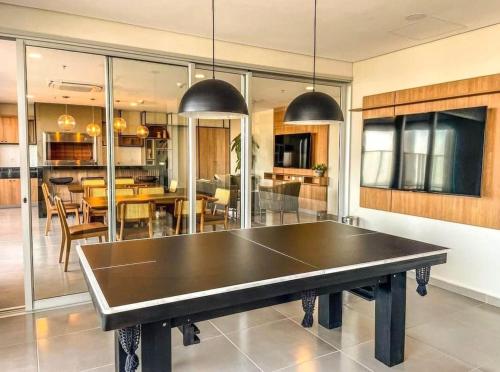 a ping pong table in the middle of a room at Dpto excelente ubicación in Asuncion