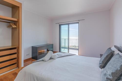 Ένα ή περισσότερα κρεβάτια σε δωμάτιο στο Sea View Apartment