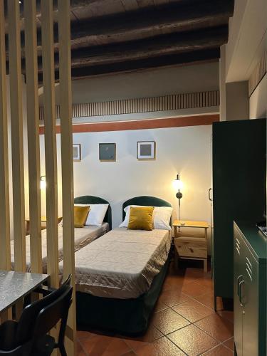 Postel nebo postele na pokoji v ubytování La Galdina - NEW LOFT X 3