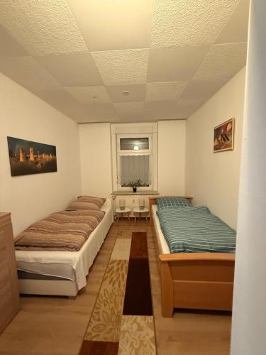 Ένα ή περισσότερα κρεβάτια σε δωμάτιο στο Ferienwohnung Goldener Drache